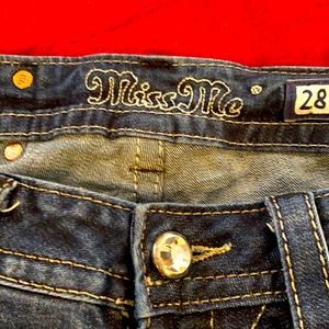 MissMe jeans. Size 28. Distressed denim. Fleur de lis symbol on back pockets.